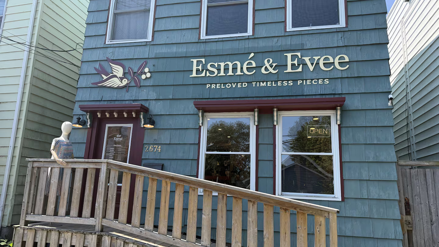 Storefront with 'Esmé & Evee' sign on a blue building